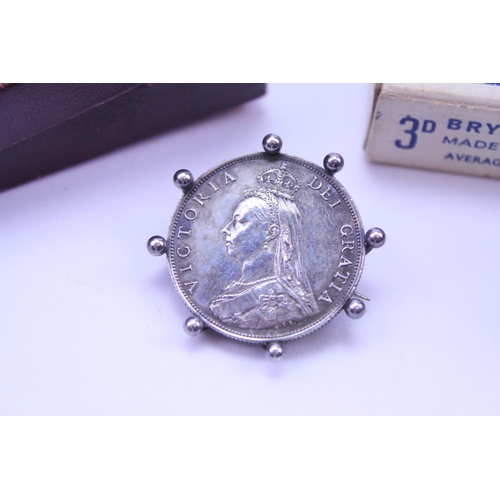 352 - An 1887 Silver Jubilee Head Half Crown mounted as a Brooch along with various Matchboxes.