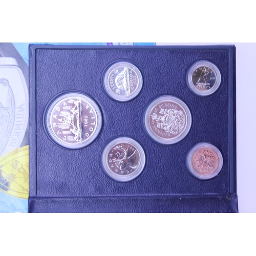 355 - A Collection of British & Foreign Coins in a Silver Box, a 1982 Canada Set of Coins, N. I. U. E. 199... 