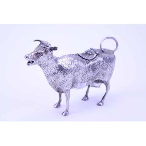 63 - A Silver Plated Cow Creamer with textured finish and bent over tail.