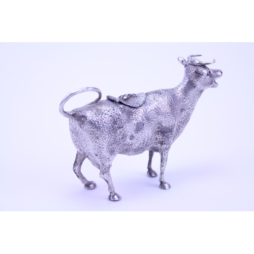 63 - A Silver Plated Cow Creamer with textured finish and bent over tail.