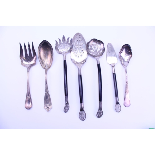 72 - Indian Silver Coloured White Metal Cutlery to include Serving Spoons, etc.