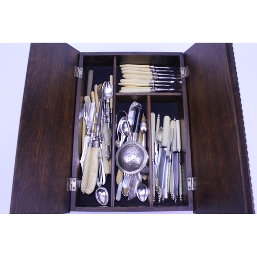 79 - A fold over topped cutlery box containing Victorian and later Silver plated cutlery including a tea ... 