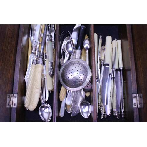 79 - A fold over topped cutlery box containing Victorian and later Silver plated cutlery including a tea ... 