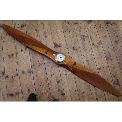 297 - An interesting Mahogany 3-Ply Propeller marked 7242054 NP 0889 with a fixed Clock. Measuring 184cms.