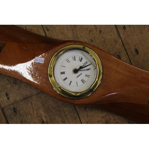 297 - An interesting Mahogany 3-Ply Propeller marked 7242054 NP 0889 with a fixed Clock. Measuring 184cms.