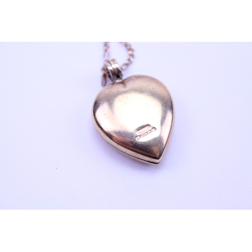 195 - A 9ct Gold chain, hung with a 9ct Gold heart shaped locket. Total weight 7.6g.