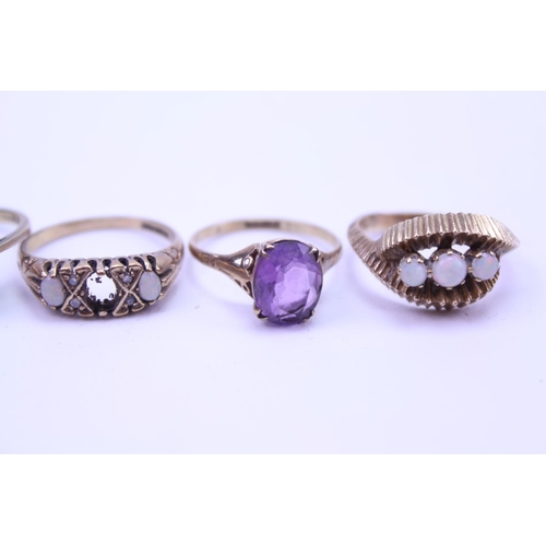 197 - Five 9ct Gold rings, set with various stones. Total weight approx 14.7g.