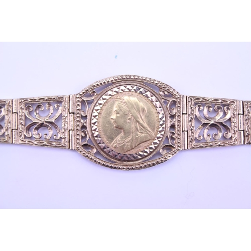 361 - A Ladies Gold Pierced & engraved flexible link Bracelet in 9ct Gold mounted with a Victorian Vale He... 