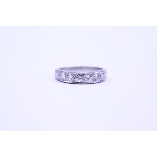 212 - A Ladies 18ct Gold Half Eternity Ring mounted with 9 Diamonds. Weighing: 3.75 grams. Size: p. With A... 