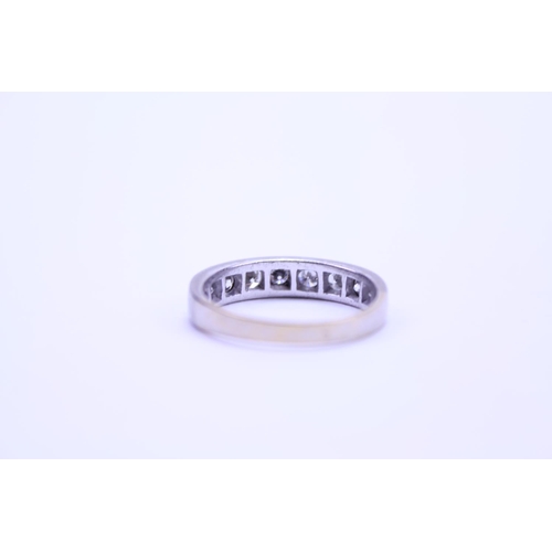 212 - A Ladies 18ct Gold Half Eternity Ring mounted with 9 Diamonds. Weighing: 3.75 grams. Size: p. With A... 