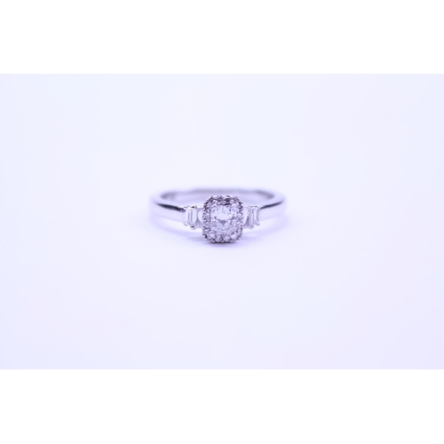 219 - A Ladies 18ct White Gold Ring set with a Radiant Cut Diamond with Diamond Chips and shoulders comple... 