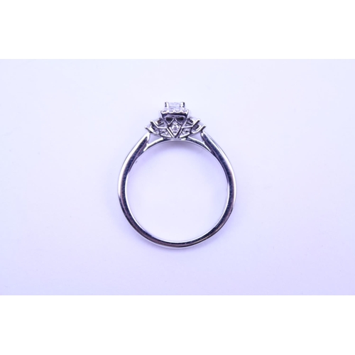 219 - A Ladies 18ct White Gold Ring set with a Radiant Cut Diamond with Diamond Chips and shoulders comple... 