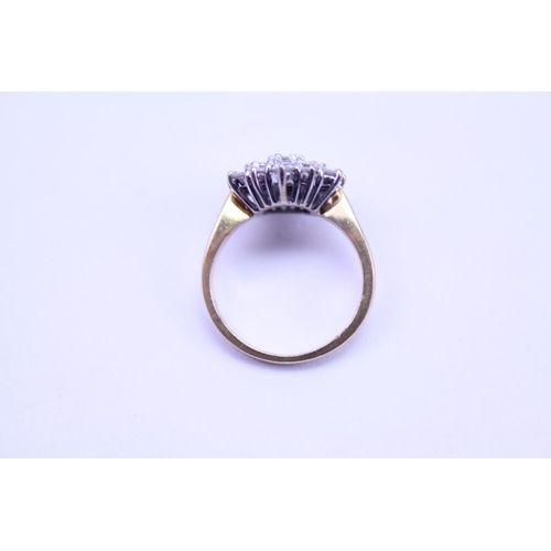 112 - An 18ct Gold Diamond Ring set with numerous Diamonds in a Cluster Setting. Size: j/k.