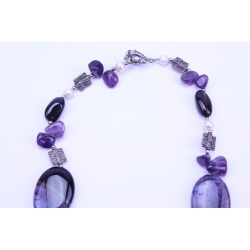 136 - A Modern Purple & Beed Necklace with Silvered Spacers.