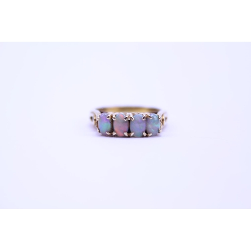 138 - A Gold coloured Opal set Ring set with 4 opals. Size approx O. Total weight approx 3.9g.