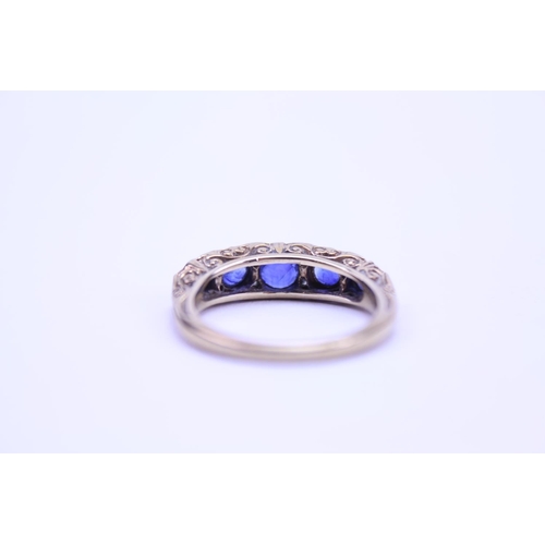 139 - An 18ct Gold Diamond and Sapphire set Ring, set with 5 Sapphires. Size approx O. Total weight approx... 