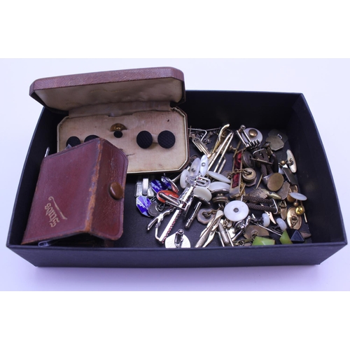 143 - A quantity of cufflinks and tie pins.