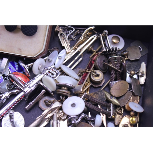 143 - A quantity of cufflinks and tie pins.