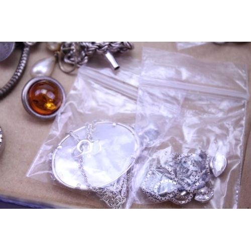 144 - A quantity of Silver jewellery to include necklaces, cameos, pendants, etc.