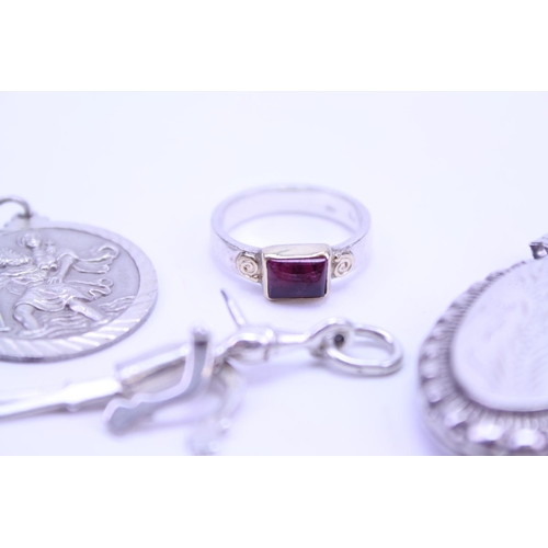 163 - A quantity of Silver jewellery to include charms, ring, etc.