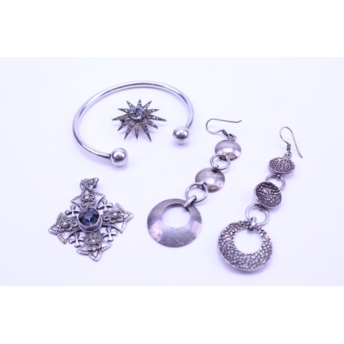 165 - A quantity of Silver jewellery to include earrings, bracelet, etc.