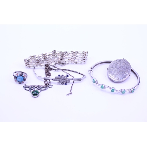 168 - A quantity of Silver jewellery to include a bangle, locket, etc.