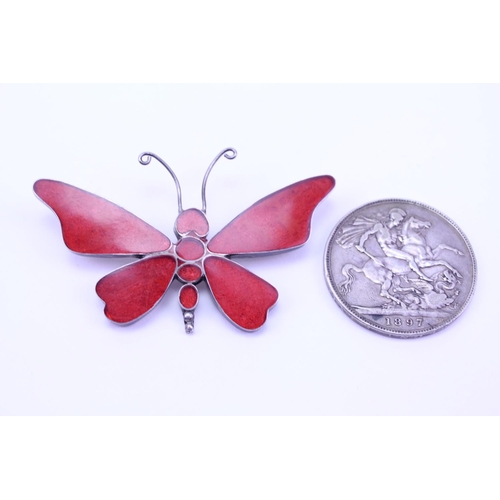 183 - A Silver enamelled butterfly pendant along with a Silver 1897 coin.