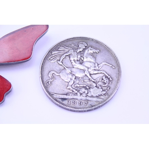 183 - A Silver enamelled butterfly pendant along with a Silver 1897 coin.