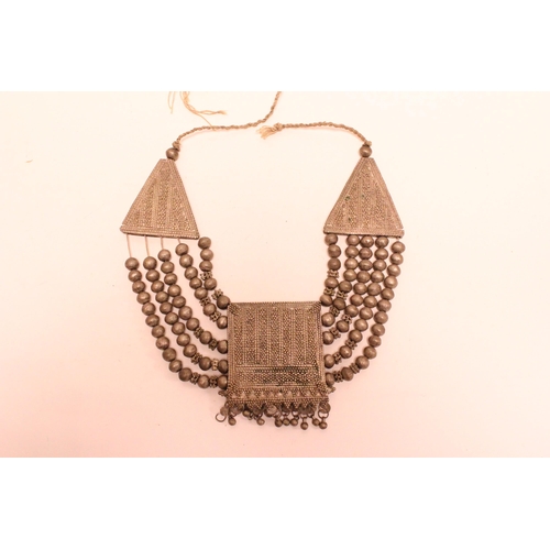 883 - A metal mounted Tibetan necklace.