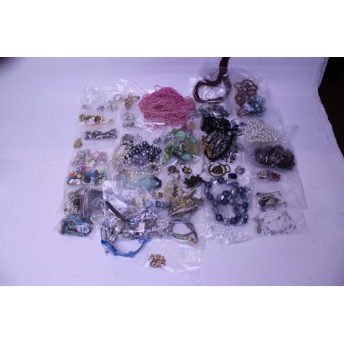 87 - A Collection of Costume Jewellery to include Bead Necklaces, Watches, Clips, etc. Needs Viewing.