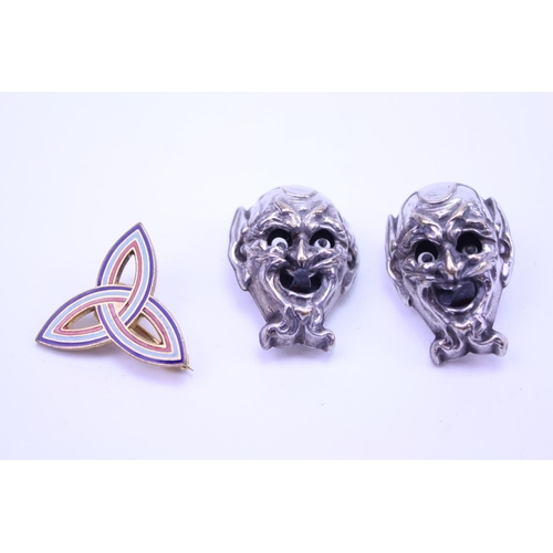 99 - Two devil head cufflinks with moving eyes and tongue along with a pin.