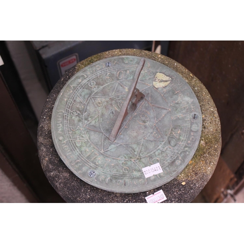 867 - A Brass Topped Sun Dial on a Concrete Base. Measuring: 75cms high.