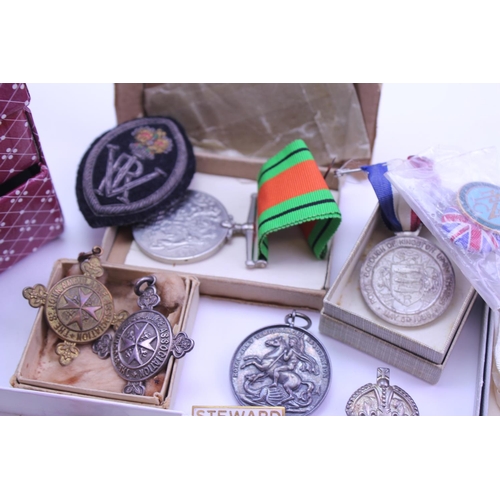 375 - A quantity of Militaria to include Mason badges, a defence medal along with various other associatio... 