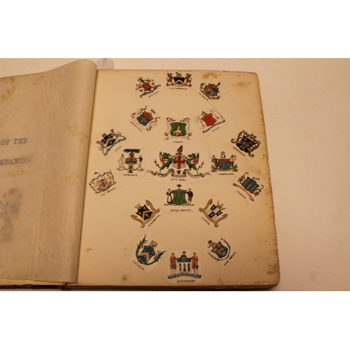 325 - An interesting Leather bound book containing letter headings, company crests, family heraldic crests... 