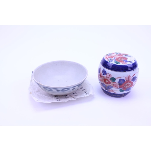 899 - A Tek Sing Grey & Cream Lost Treasures Tea Bowl along with a Japanese Imari Jar & Cover.