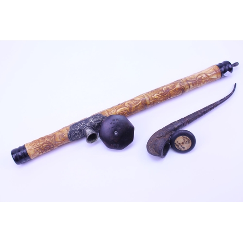 892 - A Bone mounted Opium Pipe along with one other with floral decoration.