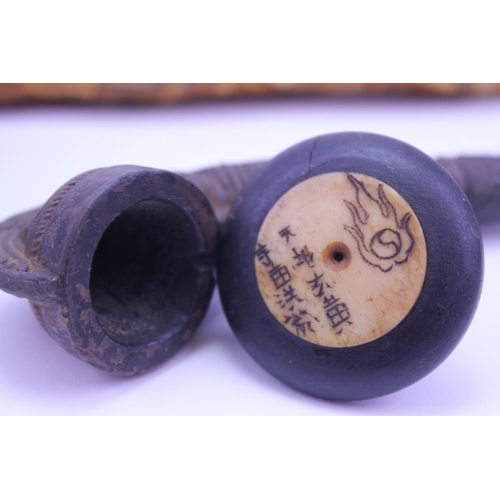 892 - A Bone mounted Opium Pipe along with one other with floral decoration.