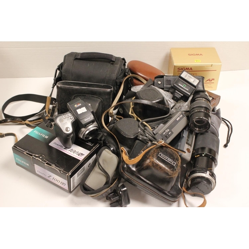 728 - A Collection of Cameras & Camera Equipment to include: Zenit, Fuji, Sigma, Kodak, etc.