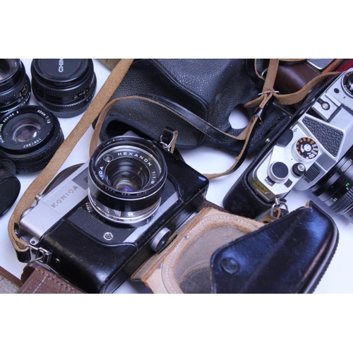 733 - A Collection of cameras to include 2 x Konica Auto S2 Cameras, a Canon QL, Ilford, Chinon, Box & var... 