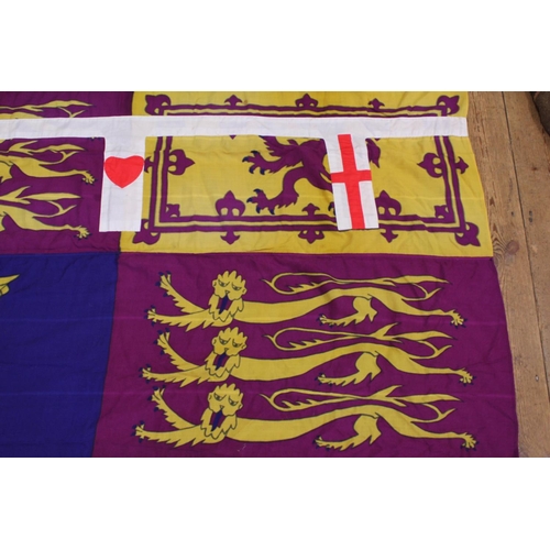 921 - A Hong Kong Standard Flag depicting English Crests hung from Princess Anne's Boat which took her aro... 