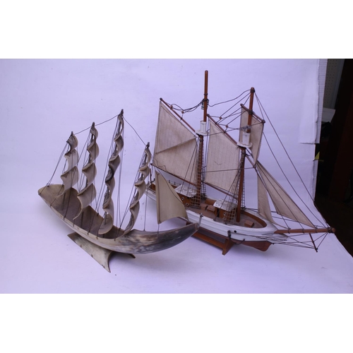 923 - A Carved Horn 4 Mast Sailing Ship along with a similar model of a Sailing Vessel.