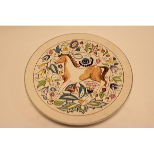 861 - A Poole Pottery Studio Ware Charger decorated with a Prancing Horse & a floral decorated background.... 