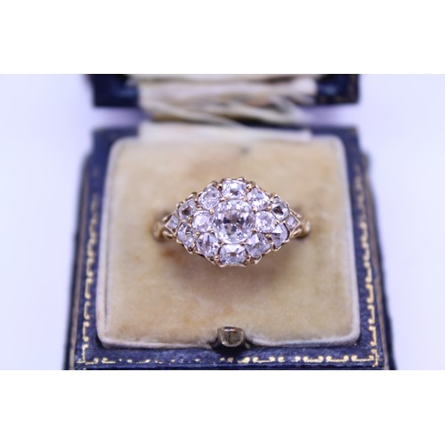 184 - An 18ct Ladies Gold & Diamond Dress Ring mounted with a Central Diamond of .80ct surrounded by small... 