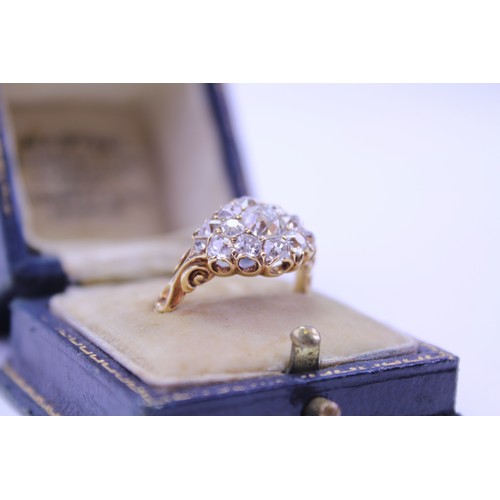 184 - An 18ct Ladies Gold & Diamond Dress Ring mounted with a Central Diamond of .80ct surrounded by small... 