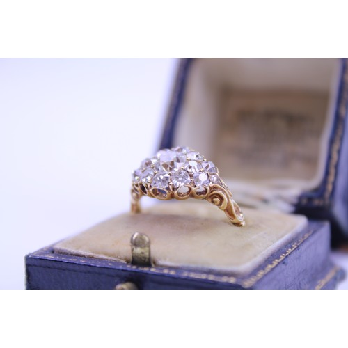 184 - An 18ct Ladies Gold & Diamond Dress Ring mounted with a Central Diamond of .80ct surrounded by small... 