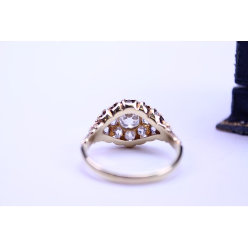 184 - An 18ct Ladies Gold & Diamond Dress Ring mounted with a Central Diamond of .80ct surrounded by small... 