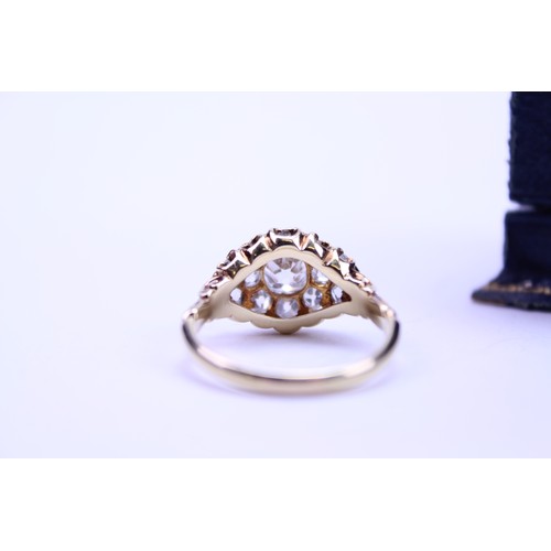 184 - An 18ct Ladies Gold & Diamond Dress Ring mounted with a Central Diamond of .80ct surrounded by small... 