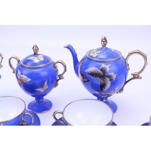 546 - A Beautiful Noritake Tea Set for 4 in Blue & Gold with a Butterfly pattern to include a Tea Pot, Fou... 