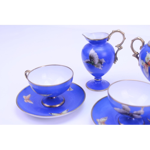 546 - A Beautiful Noritake Tea Set for 4 in Blue & Gold with a Butterfly pattern to include a Tea Pot, Fou... 