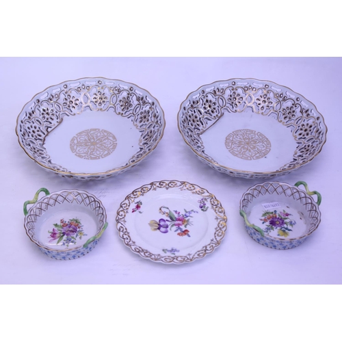 563 - Two Meissen design pierced and gilt fruit baskets along with two Dresden sweet baskets and saucer di... 